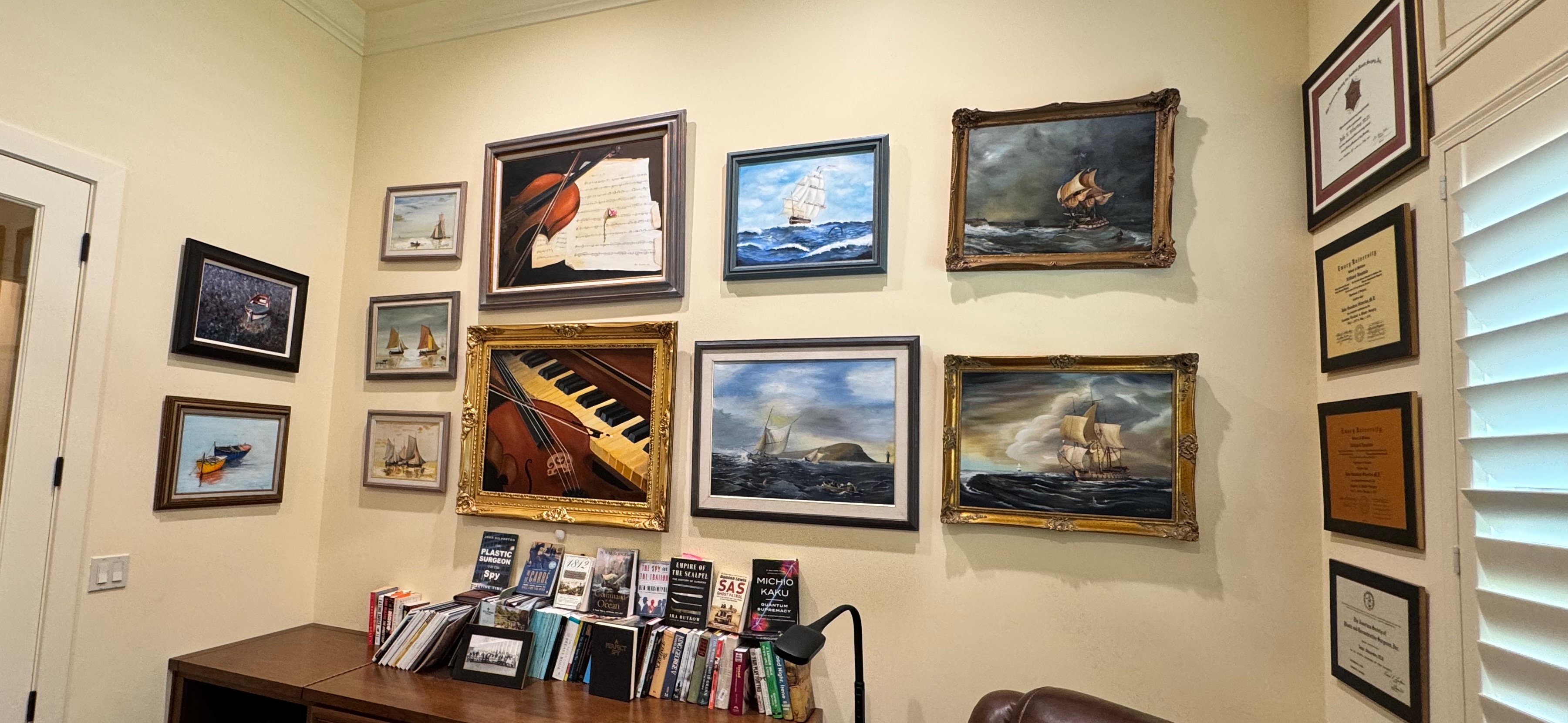 Wall of Paintings and books below